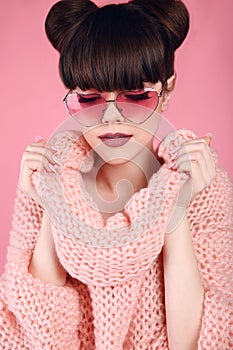 Fashion style teen girl model in knitted sweater. Brunette in he