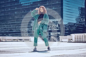 Fashion, style and woman on rooftop in city with stylish, trendy and modern outfit. Summer, freedom and carefree girl in