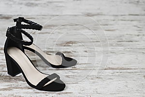 Fashion style women`s black shoes black heels copy space