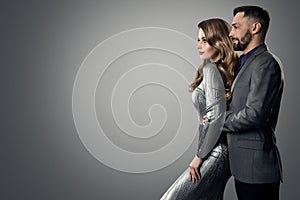 Fashion Stylish Man Woman Profile Side View. Bearded Man in Suit holding Luxury Model. Elegant lady in Silver Dress with Boyfriend