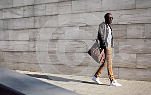 Fashion stylish young african man in sunglasses