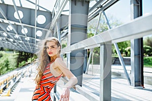 Fashion summer is a bright portrait of a young beautiful woman with long hair and colorful clothes