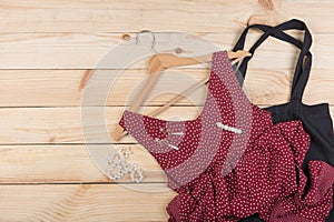 Fashion trends - black eco tote bag, red dress in polka dots on hanger and pearl jewelry: necklace, hair pearl clip, earrings