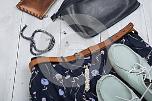 Fashion trends - blue bag, shoes and skirt in floral print, brown belt, purse and pearl jewelry