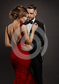 Fashion Wedding Couple in Love. Beauty Woman in Sexy Dress with Naked Back and Handsome Man in Black Suit. Gentlemen and Lady