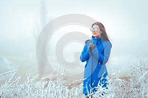 Fashion Winter Woman with Mirror Sunglasses and Blue Coat