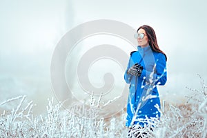 Fashion Winter Woman with Mirror Sunglasses and Blue Coat