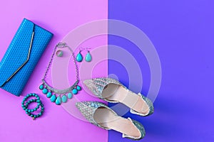 Fashion woman accessories set. Trendy fashion shoes heels, stylish handbag clutch, necklace, bracelet and ring, pink and purple ba