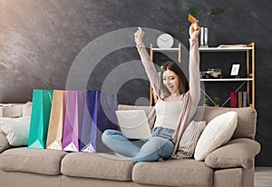 Fashion woman buying online with laptop and credit card photo