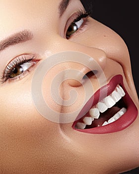 Fashion Woman Face With Perfect Smile. Female Model With Smooth Skin, Long Eyelashes, Red Lips, Healthy White Teeth