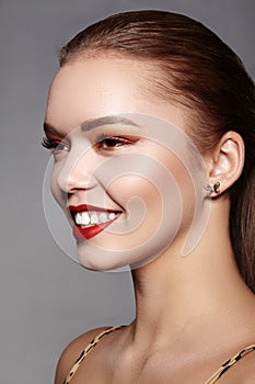 Fashion Woman Face With Perfect Smile. Female Model With Smooth Skin, Long Eyelashes, Red Lips, Healthy White Teeth