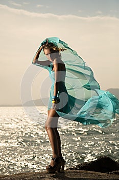 Fashion Woman In Fluttering Blue Dress