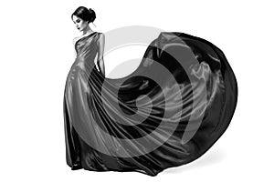 Fashion woman in fluttering dress. BW image. Isolated