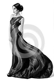 Fashion woman in fluttering dress. BW image. Isolated