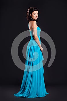 Fashion woman in funky blue long dress smiling photo