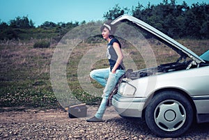 Fashion woman having troubles with car