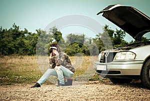 Fashion woman having troubles with car