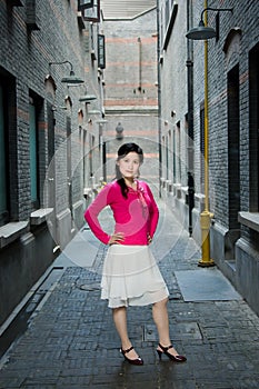 Fashion woman in old alley