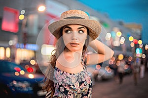 The fashion woman portrait of young pretty trendy girl posing at the city in Europe