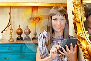 Fashion woman reading ebook tablet in grunge house