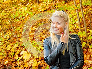 Fashion woman relaxing in autumn park