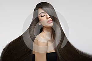 Fashion woman with straight long shiny hair. Beauty and hair care