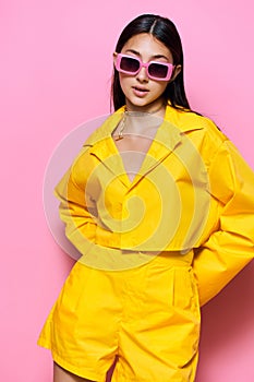 fashion woman sunglasses happy girl young lifestyle trendy yellow background attractive beautiful