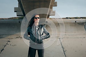 Fashion Woman with Sunglasses and Leather Jacket Rock Biker Style