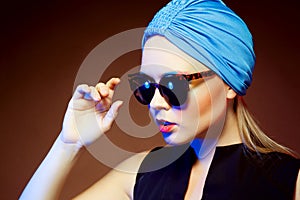 Fashion woman in sunglasses, studio shot. Professional makeup an