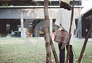 Fashion woman with vintage leather bag