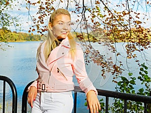 Fashion woman walking in autumn park