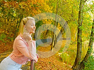 Fashion woman walking in autumn park