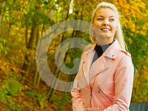 Fashion woman walking in autumn park