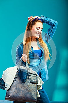 Fashion woman wearing blue denim with bag