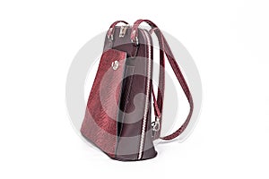 Fashion women leather dark red backpack isolated on a white background.