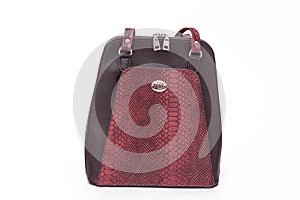 Fashion women leather dark red backpack isolated on a white background.