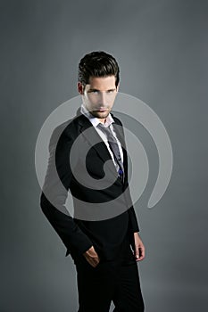 Fashion young businessman black suit casual tie