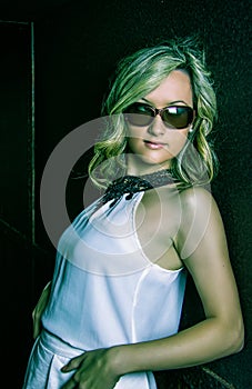 Fashion young girl with sunglasses and white dress