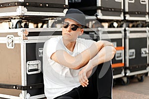 Fashion young guy with sunglasses and a stylish black cap