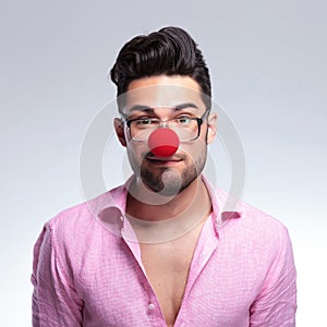 Fashion young man with a red nose