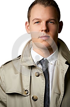 Fashion young man with trenchcoat photo