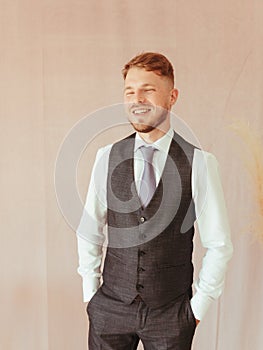 fashion young man wearing black tuxedo, grain effect studio blond