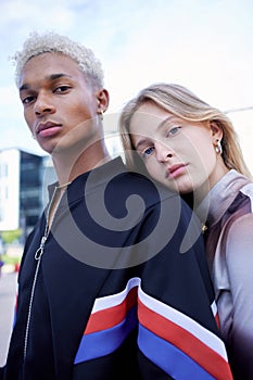 Fashion, youth and portrait of couple in city pose for selfie wearing trendy, stylish and cool clothes. Diversity