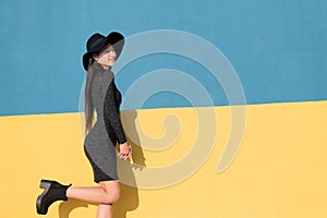 Fashionable asian young woman posing happy