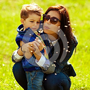 Fashionable baby boy and his gorgeous mother