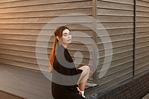 Fashionable beautiful young model woman in black stylish coat