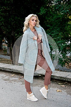 Fashionable bow: woman in a coat