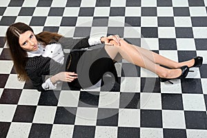 Fashionable business woman lying on a floor