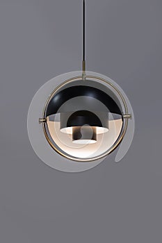 Fashionable chandelier with brass elements, black modern pendant lamp in loft style. Interesting hemispherical design