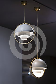 Fashionable chandelier with brass elements, gray modern pendant lamp in loft style. Interesting hemispherical design